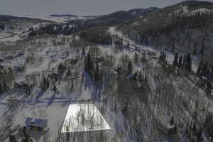 Snowy aerial view featuring a mountain view