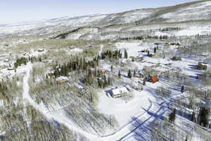 Snowy aerial view featuring a mountain view