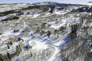 Snowy aerial view featuring a mountain view