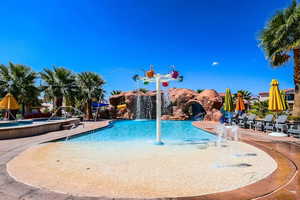 View of pool featuring pool water feature