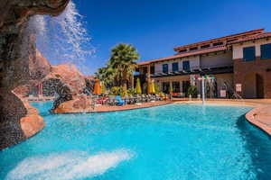 View of swimming pool featuring a patio and pool water feature