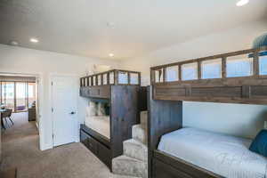 Bedroom with light colored carpet