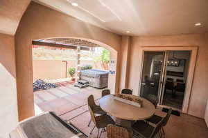 View of patio / terrace featuring a hot tub