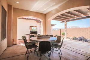 View of patio / terrace with area for grilling and a pergola