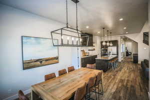 Dining room featuring dark hardwood / wood-style floors and sink