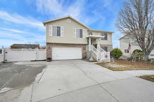 Split foyer home featuring a garage