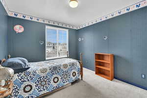 Bedroom with carpet and a textured ceiling