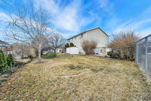 View of property exterior featuring a yard