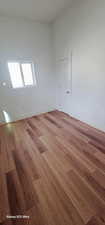 Spare room with hardwood / wood-style floors