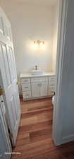 Bathroom with wood-type flooring and vanity