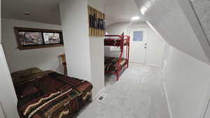 Furnished Upstairs Loft with bed space and lofted textured ceiling