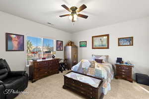 Bedroom featuring light colored carpet and ceiling fan