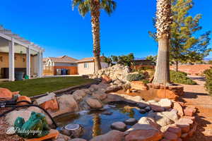 View of yard with a pergola