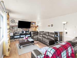 Living room with hardwood / wood-style floors