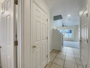 Hallway with light tile patterned floors