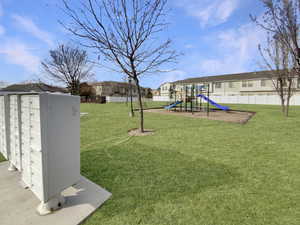 View of playground featuring a yard