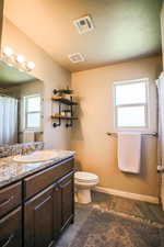 Bathroom with vanity and toilet