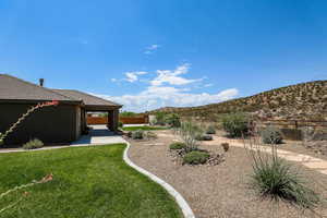 View of yard with a mountain view and a patio area