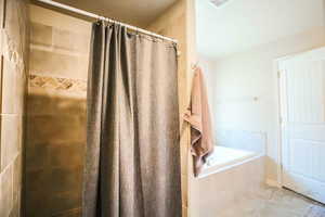 Bathroom featuring a shower with curtain