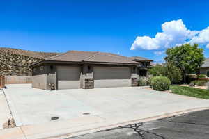 Prairie-style house featuring a garage and a mountain view