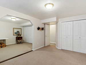 The wall opening could easily be closed up to restore an additional bedroom in the basement.