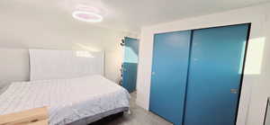 Bedroom with a closet and light wood-type flooring