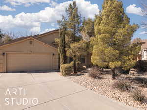 View of front of property featuring a garage