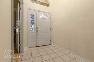 Foyer featuring light tile patterned flooring