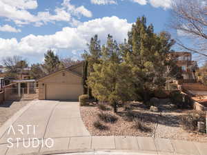 View of front of property featuring a garage