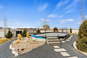 View of yard featuring a covered pool