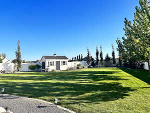 View of yard with an outdoor structure