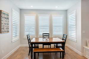 Dining room with light hardwood / wood-style floors