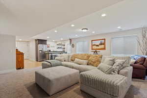 Living room featuring light colored carpet