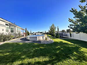 View of yard featuring a fenced in pool