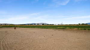 View of yard featuring a view of countryside and a mountain view
