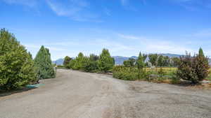 View of road featuring a mountain view and a view of countryside