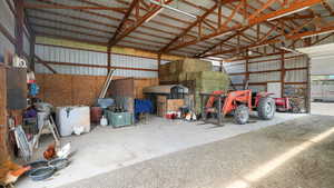 Garage featuring metal wall