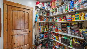 Pantry with door to utility closet