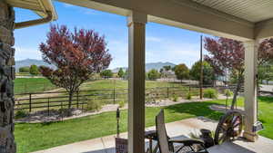 View of patio / terrace with a mountain view and a rural view