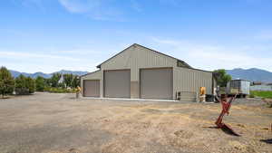 Detached garage with a mountain view