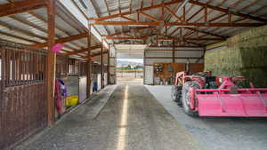Horse barn featuring a mountain view