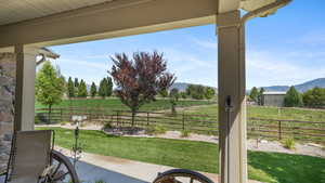 View of patio featuring a view of rural / pastoral area and a mountain view
