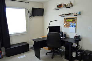 View of carpeted home office