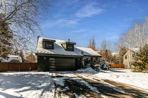 View of front of property featuring a garage