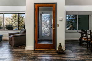 Entryway featuring dark wood-type flooring and a textured ceiling