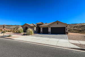 View of front of property featuring a garage