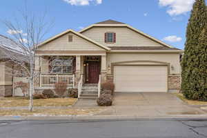 View of front of house with a garage and covered porch