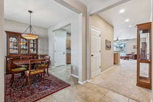 Dining room with light colored carpet