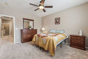 Bedroom featuring light colored carpet and ceiling fan