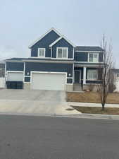 View of front of property featuring a garage